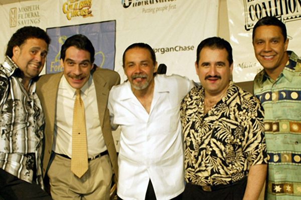 left to right: violinist - Alfredo de la Fé, flautist -Dave Valentin, percussionist - Angel Rodriguez, trombonist - Demetrios Kastaris, singer - Herman Olivera, "Homenaje a Mongo Santamaria" (Homage to Mongo Santamaria) Concert, June 16, 2003, Seuffert Bandshell, Woodhaven Queens, New York, photo credit Jerry Lacay.