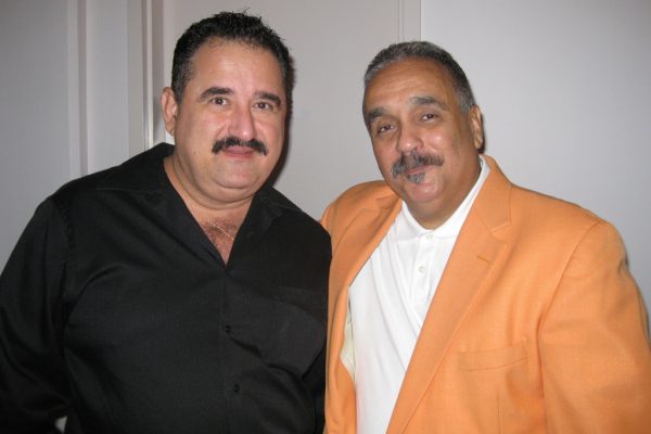 Left: Demetrios Kastaris, right Latin music icon, singer, trombonist, Willie Colon, at the Queens Theatre in the Park, Flushing, New York, October 2010