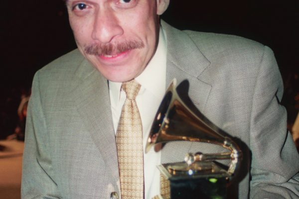 Dave Valentin with his Grammy Award, June 16, 2003, Homenaje a Mongo Santamaría Concert, Seuffert Bandshell, Woodhaven Queens, New York, Photo credit: Jerry Lacay.