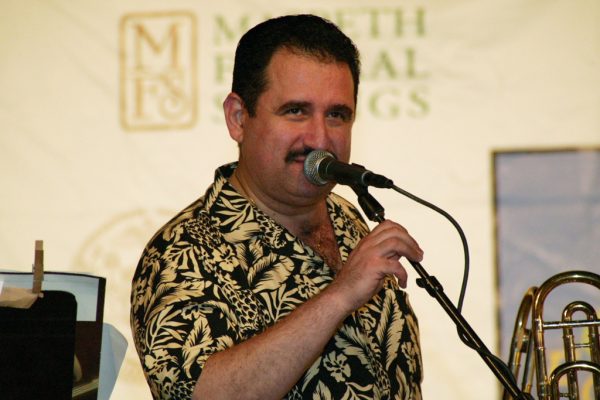 Demetrios making announcents, June 16, 2003, Homenaje a Mongo Santamaría Concert, Seuffert Bandshell, Woodhaven Queens, New York, Photo credit: Jerry Lacay.