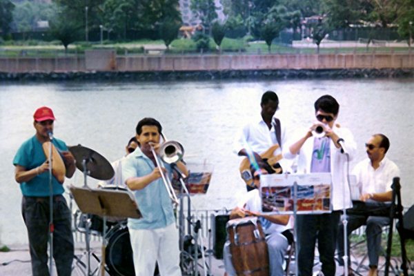 left to right: Hiram Remón - vocals, Johnny Ubiera - drums, Demetrios Kastaris - trombone, Marc Saunders - congas, Donald Nicks - bass, Walter White - trumpet, Sam Barrios - piano, Rainey Park, Astoria, Queens, June 18, 1989