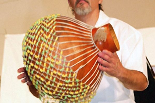 Angel Rodriguez plays a solo on the Afro Cuban chékere, June 16, 2003, Seuffert Bandshell, Woodhaven Queens, New York (photo credit Jerry Lacay)