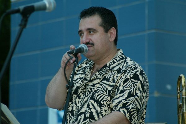 Demetrios making announcements, June 16, 2003, Homenaje a Mongo Santamaría Concert, Seuffert Bandshell, Woodhaven Queens, New York, Photo credit: Jerry Lacay.