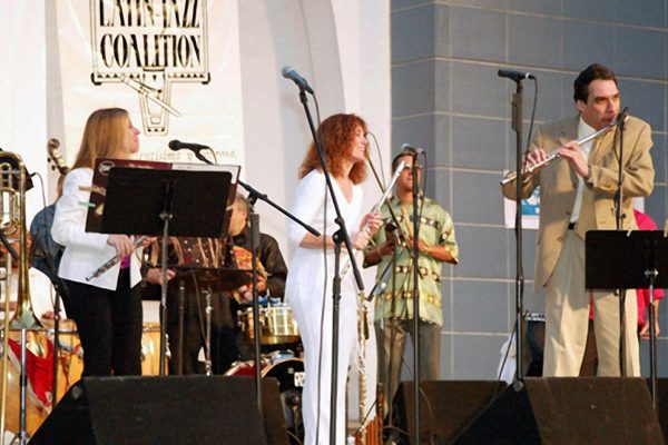 Front row left to right: Connie Grossman, Andrea Brachfeld, Dave Valentin , in background Herman Olivera, "Homenaje a Mongo Santamaria" (Homage to Mongo Santamaria) Concert, June 16, 2003, Seuffert Bandshell, Woodhaven Queens, New York (photo credit Jerry Lacay)