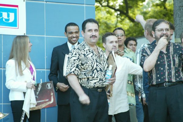 Before the show, Connie Grossman, Wesley Reynoso, Demetrios Kastaris, Memo Acevedo, Herman Olivera (El Sonero del Siglo), Herman’s son, next Victor Rendón, June 16, 2003, Homenaje a Mongo Santamaría Concert, Seuffert Bandshell, Woodhaven Queens, New York, Photo credit: Jerry Lacay