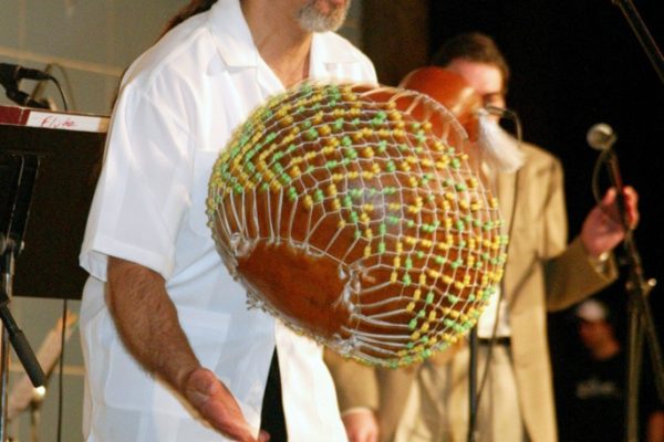 Master Percussionist Angel Rodriguez on the chekeré, June 16, 2003, Homenaje a Mongo Santamaría Concert, Seuffert Bandshell, Woodhaven Queens, New York, Photo credit: Jerry Lacay.