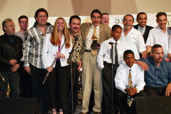 After the show, Edy Martinez, John Walsh, Alfredo de la Fé, Connie Grossman, Demetrios Kastaris, Dave Valentin, Wayne Goodman, Anthony Almonte Leon, Frank Almonte Leon, Angel Rodriguez, Wesley Reynoso, Solo Rodriguez, Hiram Remón, June 16, 2003, Homenaje a Mongo Santamaría Concert, Seuffert Bandshell, Woodhaven Queens, New York, Photo credit: Jerry Lacay.