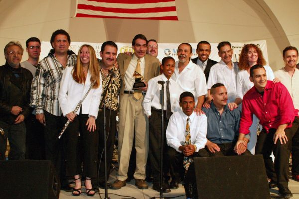 After the show, Edy Martinez, John Walsh, Alfredo de la Fé, Connie Grossman, Demetrios Kastaris, Dave Valentin, Wayne Goodman, Anthony Almonte Leon, Frank Almonte Leon, Angel Rodriguez, Wesley Reynoso, Solo Rodriguez, Hiram Remón, Andrea Brachfeld, Alí Bello, Memo Acevedo, June 16, 2003, Homenaje a Mongo Santamaría Concert, Seuffert Bandshell, Woodhaven Queens, New York, Photo credit: Jerry Lacay.