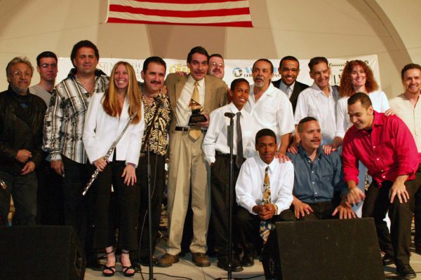 After the show, Edy Martinez, John Walsh, Alfredo de la Fé, Connie Grossman, Demetrios Kastaris, Dave Valentin, Wayne Goodman, Anthony Almonte Leon, Frank Almonte Leon, Angel Rodriguez, Wesley Reynoso, Solo Rodriguez, Hiram Remón, Andrea Brachfeld, Alí Bello, Memo Acevedo, June 16, 2003, Homenaje a Mongo Santamaría Concert, Seuffert Bandshell, Woodhaven Queens, New York, Photo credit: Jerry Lacay.