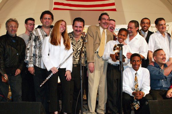 After the show, Edy Martinez, John Walsh, Alfredo de la Fé, Connie Grossman, Demetrios Kastaris, Dave Valentin, Wayne Goodman, Anthony Almonte Leon, Frank Almonte Leon, Angel Rodriguez, Wesley Reynoso, Solo Rodriguez, Hiram Remón, June 16, 2003, Homenaje a Mongo Santamaría Concert, Seuffert Bandshell, Woodhaven Queens, New York, Photo credit: Jerry Lacay.