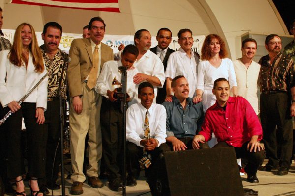 After the show, June 16, 2003, Connie Grossman, Demetrios Kastaris, Wayne Goodman, Dave Valentin, Anthony Almonte Leon, Frank Almonte Leon, Angel Rodriguez, Wesley Reynoso, Solo Rodriguez, Hiram Remón, Andrea Brachfeld, Alí Bello, Memo Acevedo, Victor Rendón, Homenaje a Mongo Santamaría Concert, Seuffert Bandshell, Woodhaven Queens, New York, Photo credit: Jerry Lacay.