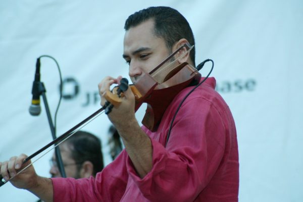 Violin virtuoso Alí Bello from Venezuela, June 16, 2003, Homenaje a Mongo Santamaría Concert, Seuffert Bandshell, Woodhaven Queens, New York, Photo credit: Jerry Lacay.