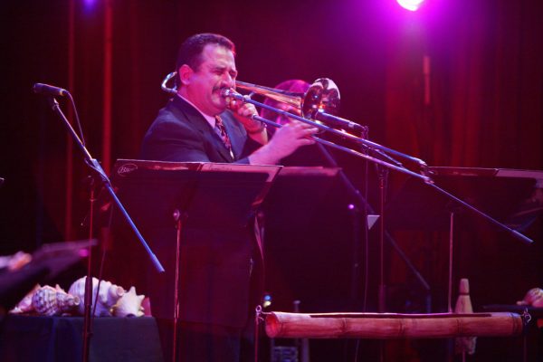 Demetrios Kastaris taking a solo on his trombone, Queens Theatre in the Park, Flushing New York, December 17, 2004, photo credit Jerry Lacay.