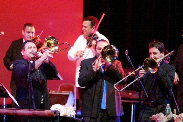 Trombonists fire it up! Demetrios, Steve Turre, Noah Bless, background Alí Bello, Alfredo de la Fé, Queens Theatre in the Park, Flushing New York, December 17, 2004, photo credit Jerry Lacay.
