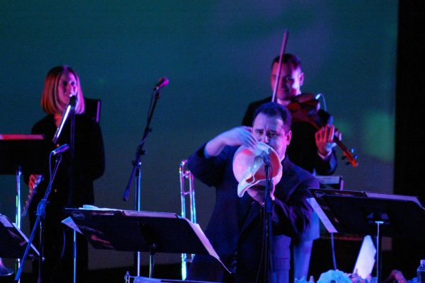 Connie Grossman, Demetrios Kastaris on a large conch shell, Alí Bello, Queens Theatre in the Park, Flushing New York, December 17, 2004, photo credit Jerry Lacay.