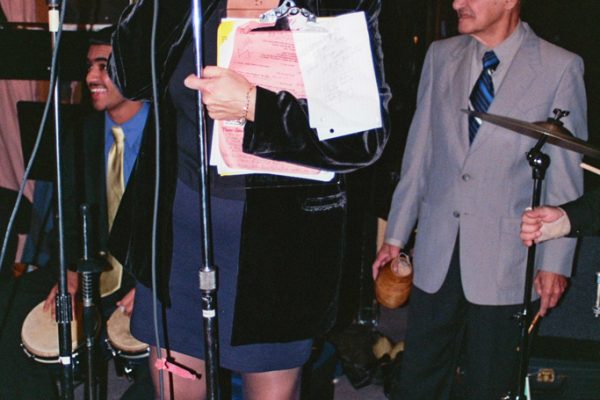 Vicki Solá announcing the orchestras, Hiram Remón, at Vicki’s Radio Station WFDU Fundraiser Concert.