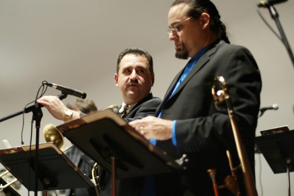 Demetrios and Jazz icon trombonist Steve Turre discussing the music before the concert, Queens Theatre in the Park, Flushing New York, December 17, 2004, photo credit Jerry Lacay.