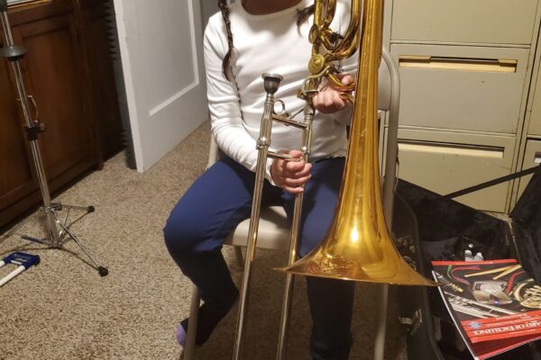 Demetrios's granddaughter Carmen while only age 9 (October 2024) , playing the bass trombone at her lesson with Demetrios. The tradition lives on! ¡Que viva la tradición!